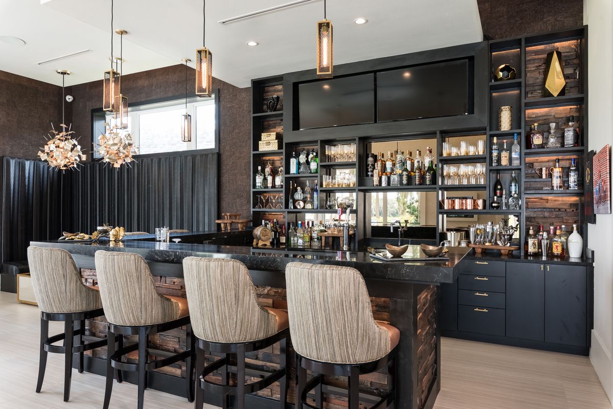 Custom bar with dark cabinetry